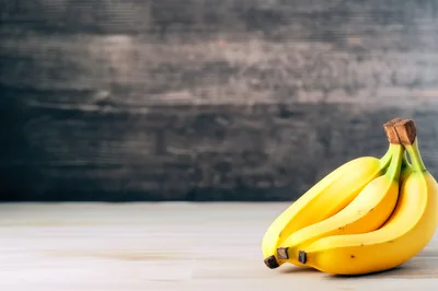 Fresh Yellow Bananas On A Wooden Table
