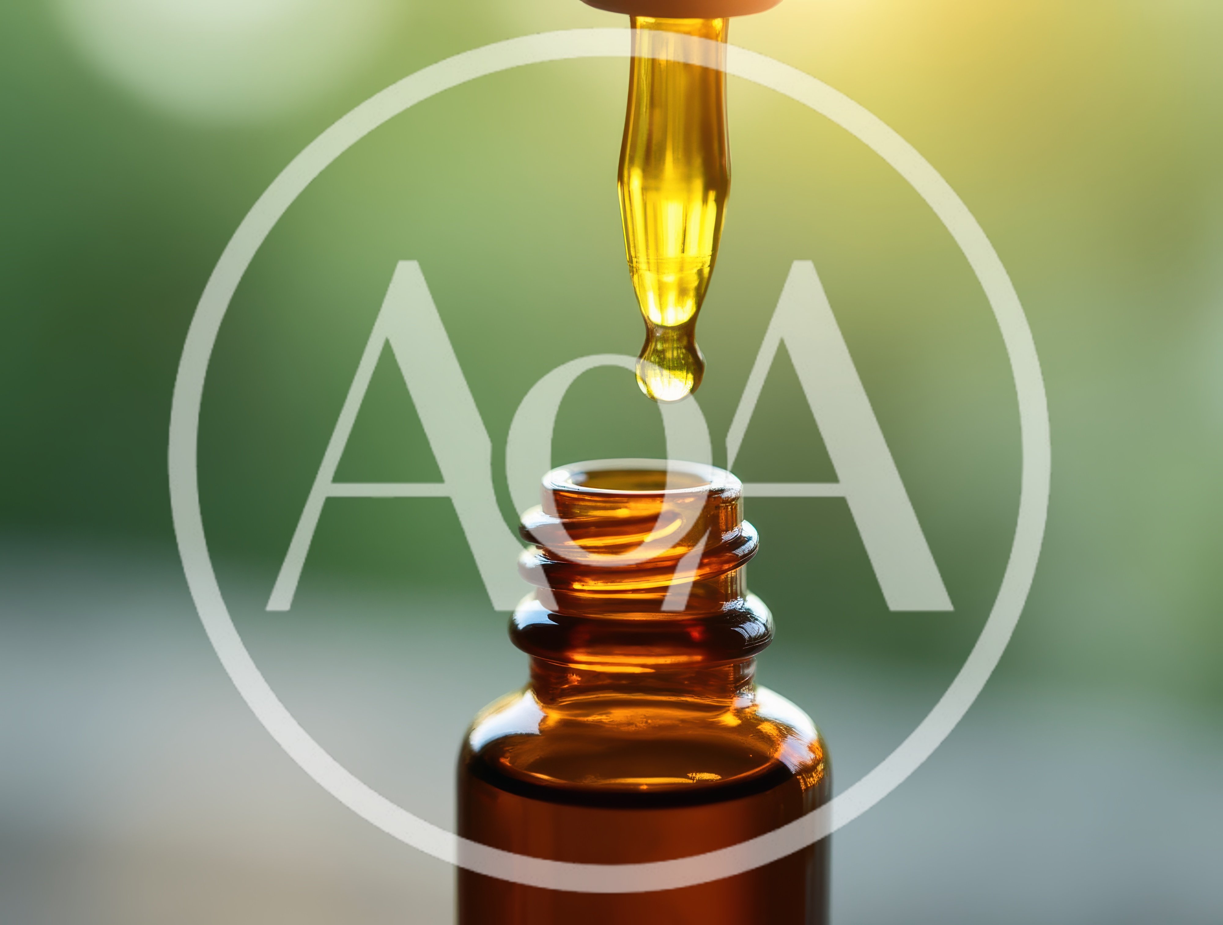 Dropper Dispensing Essential Oil Into Amber Glass Bottle