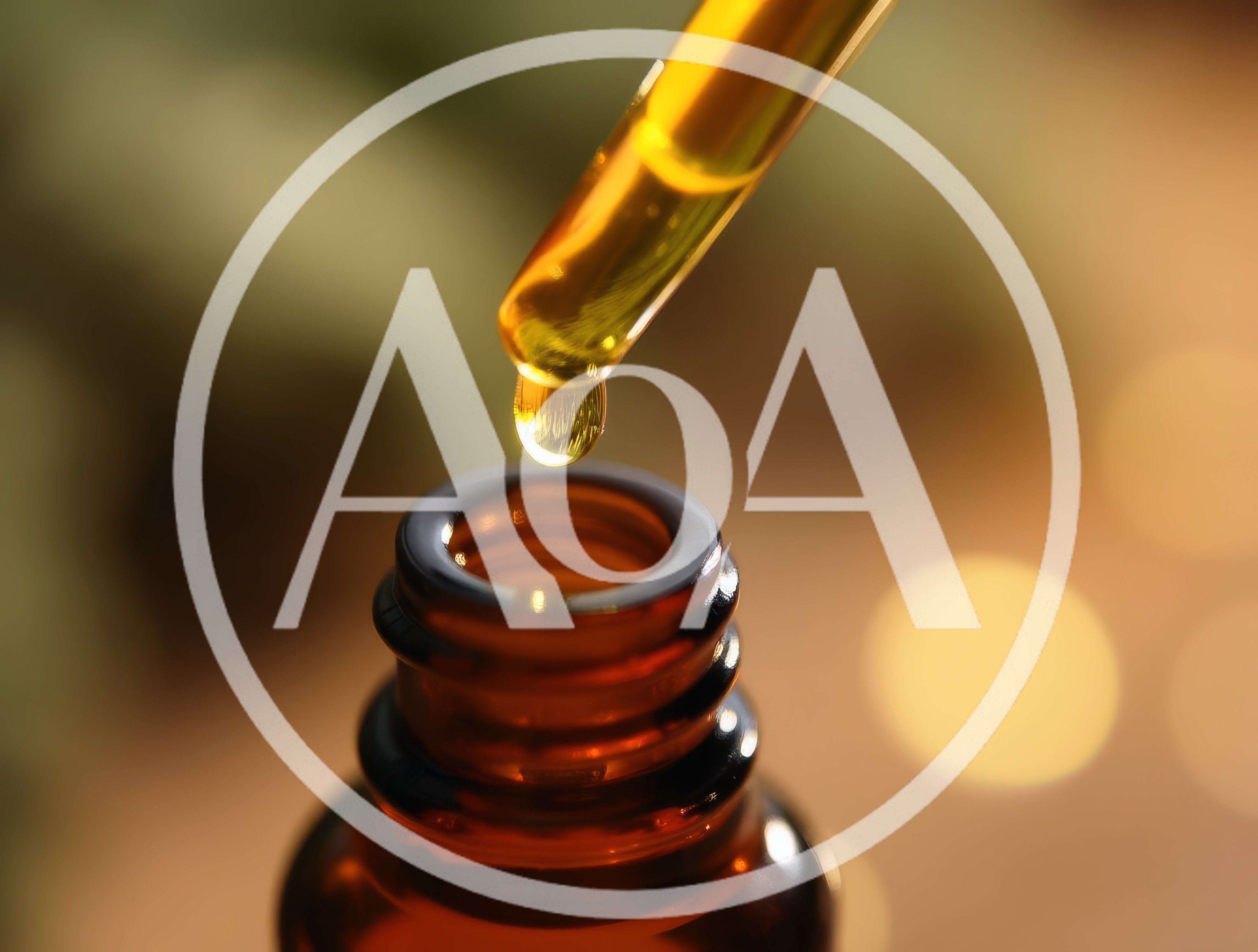 Dropper Dispensing Golden Essential Oil Into Amber Bottle