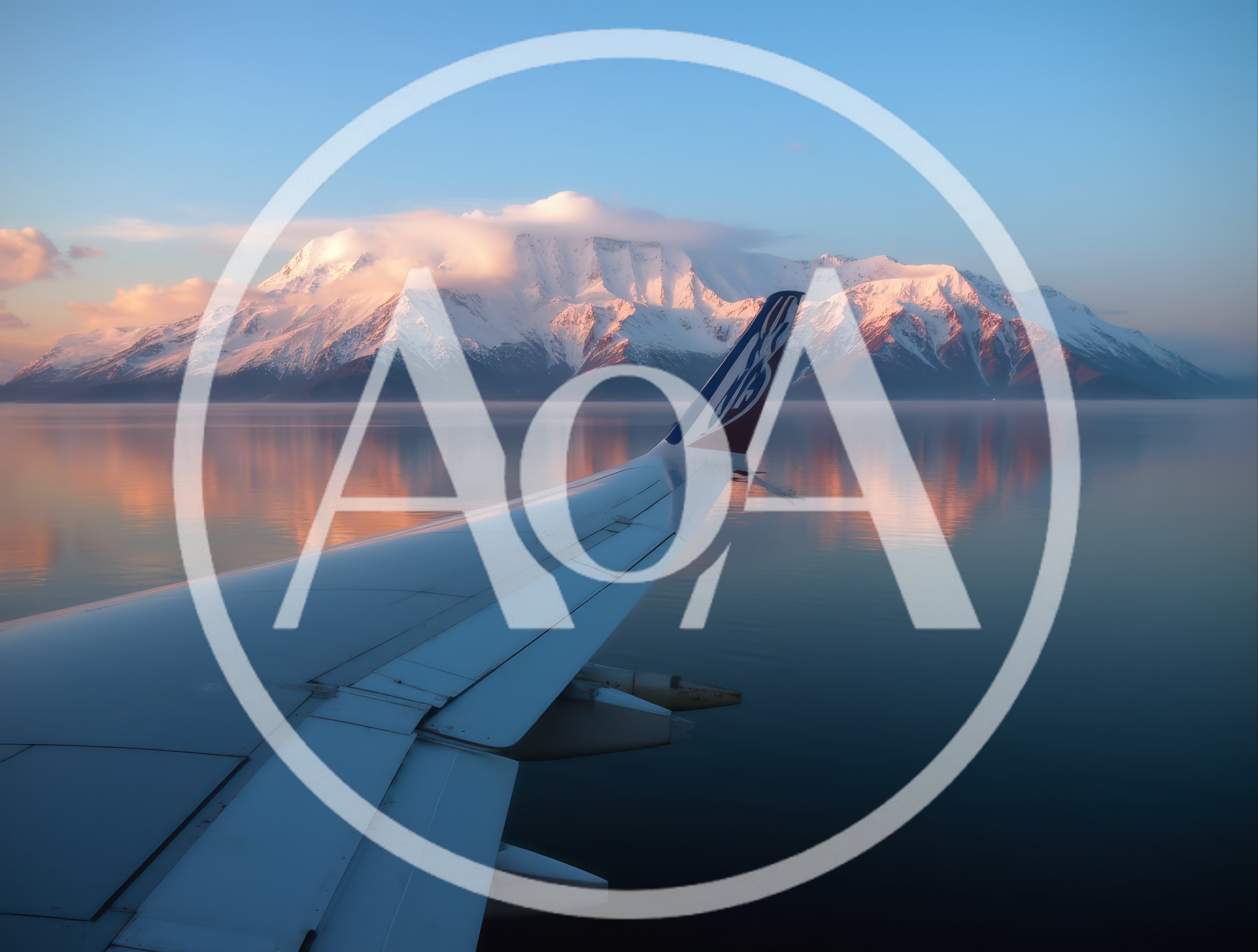 Airplane Wing View Over Snowy Mountains And Calm Water