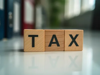 Wooden Blocks Spelling Tax on Office Desk