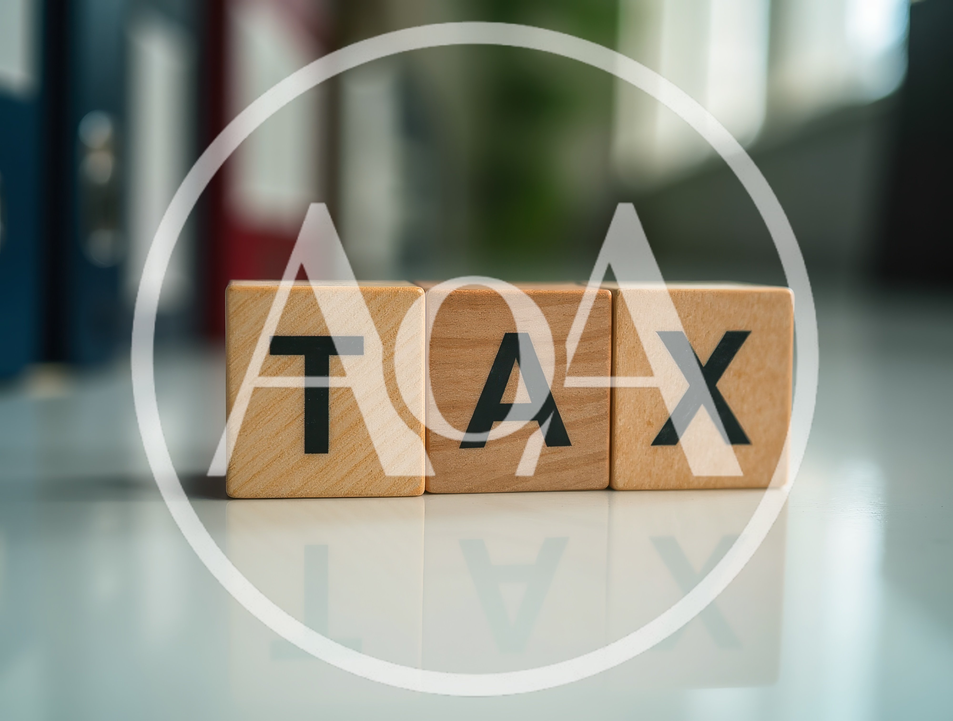 Wooden Blocks Spelling Tax on Office Desk