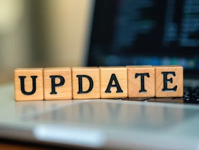 Wooden Blocks Spelling Update On A Laptop Keyboard