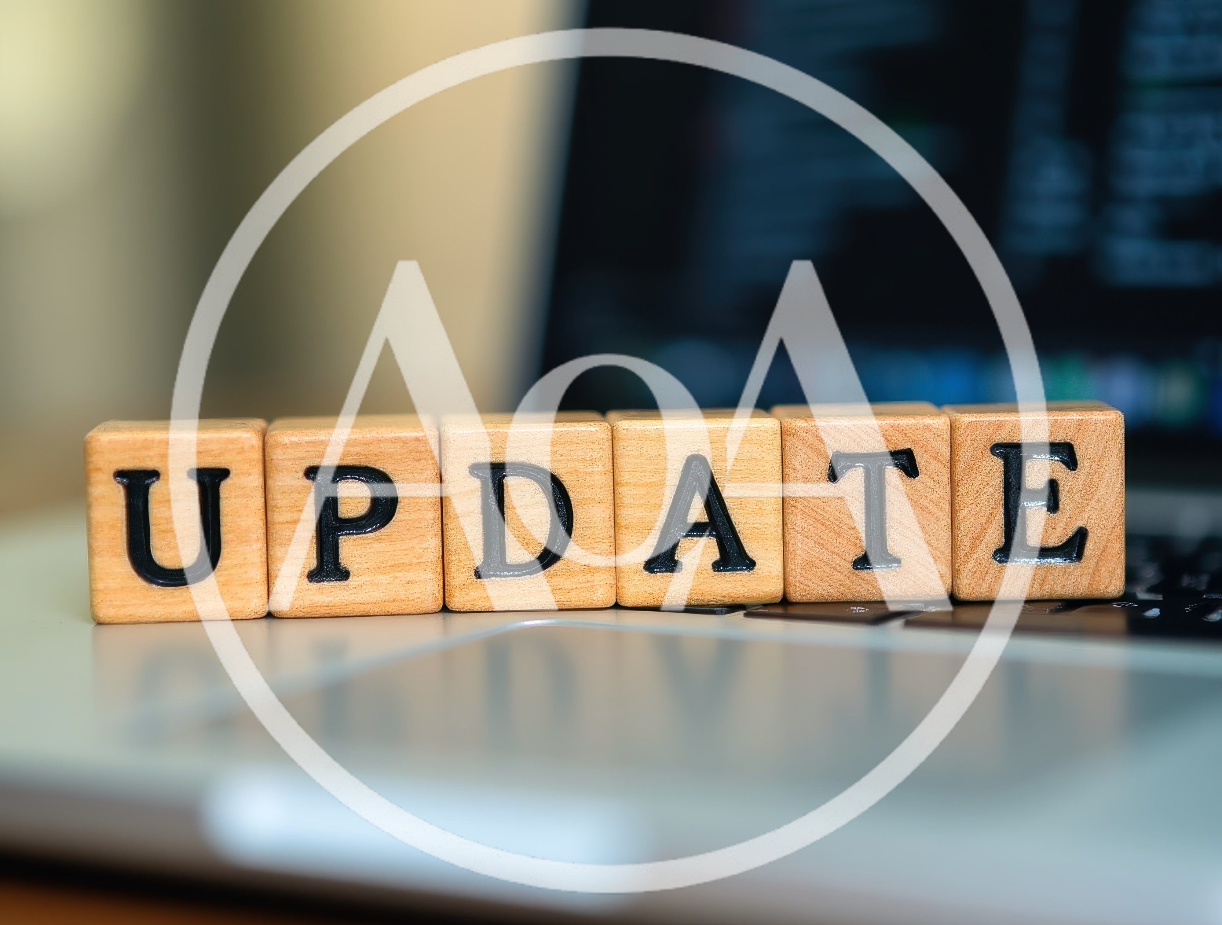 Wooden Blocks Spelling Update On A Laptop Keyboard