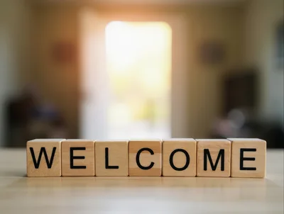 Wooden Blocks Spelling Welcome On A Table