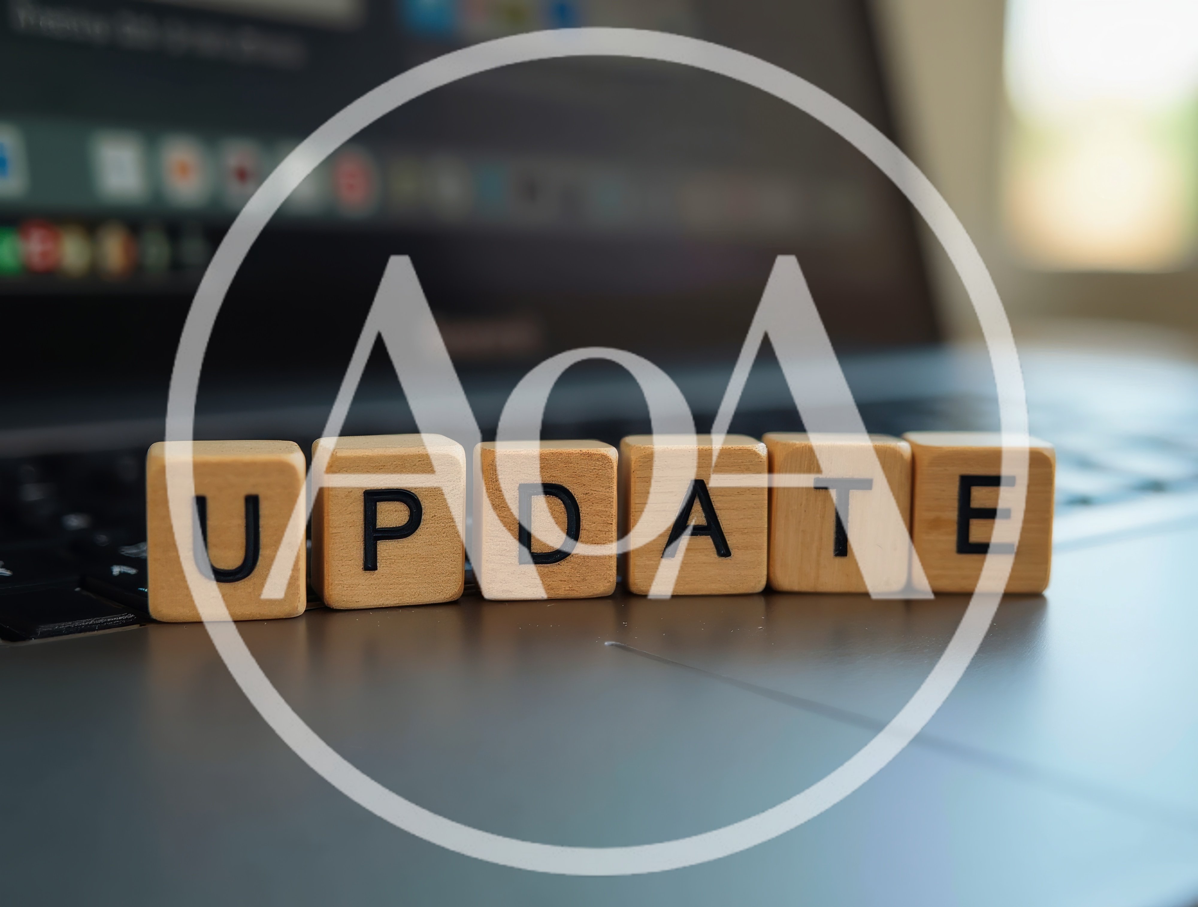 Wooden Blocks Spelling Update On Laptop Keyboard