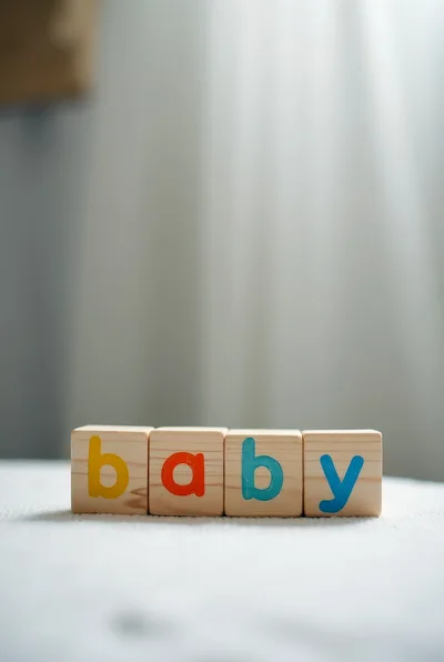 Wooden Blocks Spelling Baby On A Soft Surface