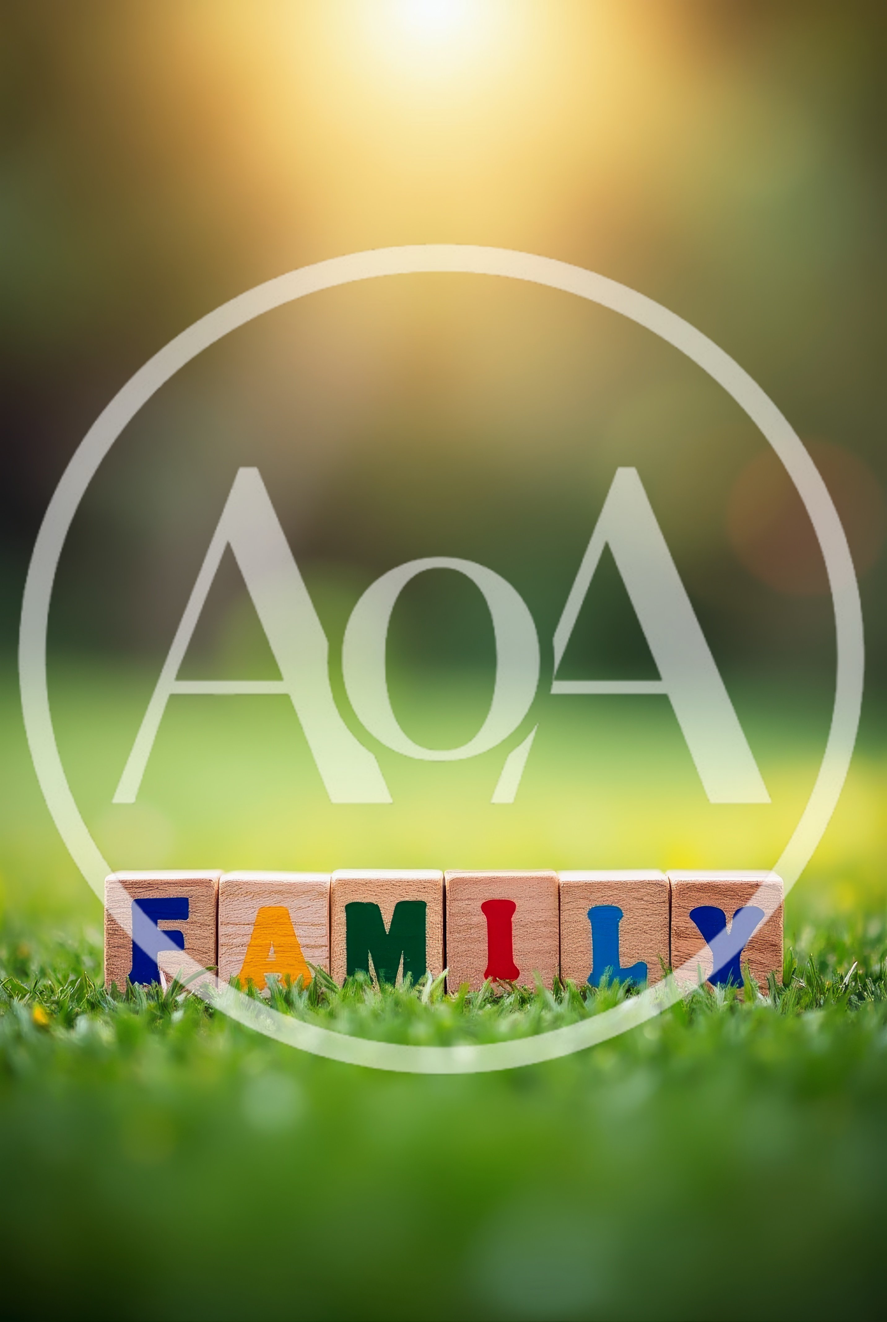 Wooden Blocks Spelling Family On Green Grass