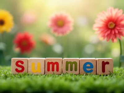 Wooden Blocks Spelling Summer On Green Grass