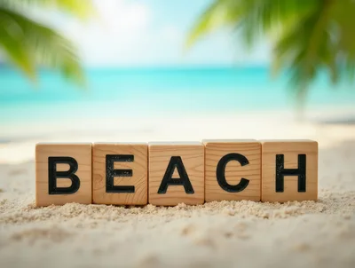 Wooden Blocks Spelling Beach On Tropical Sand