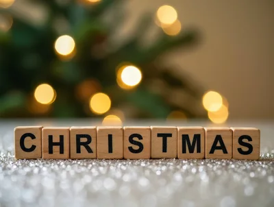 Wooden Blocks Spelling Christmas on Glittery Surface