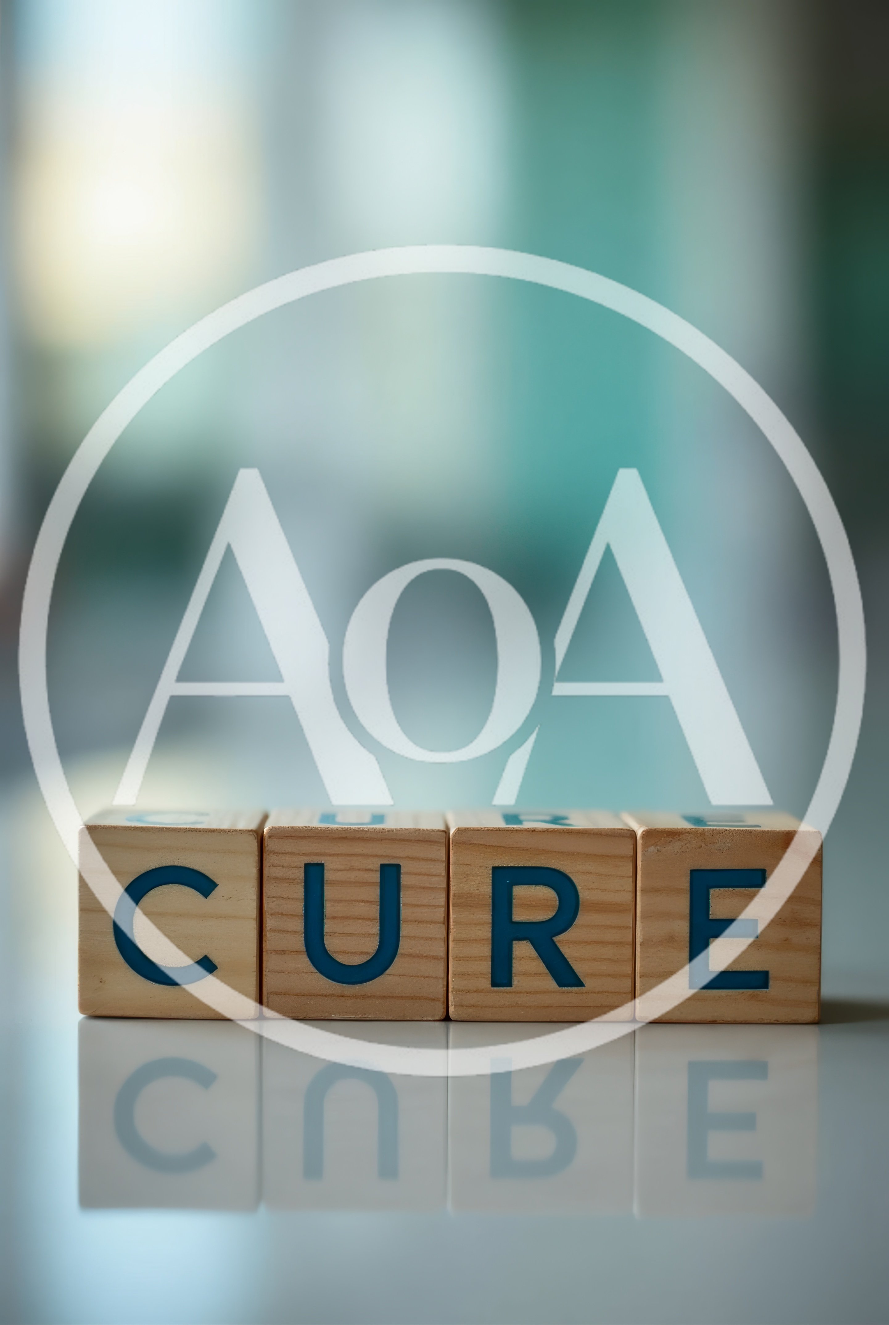 Wooden Blocks Spelling The Word Cure On Reflective Surface