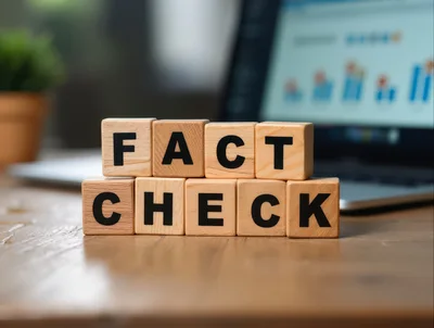 Wooden Blocks Spelling Fact Check on Office Desk