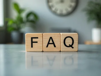 Wooden Blocks Spelling FAQ On A Reflective Surface