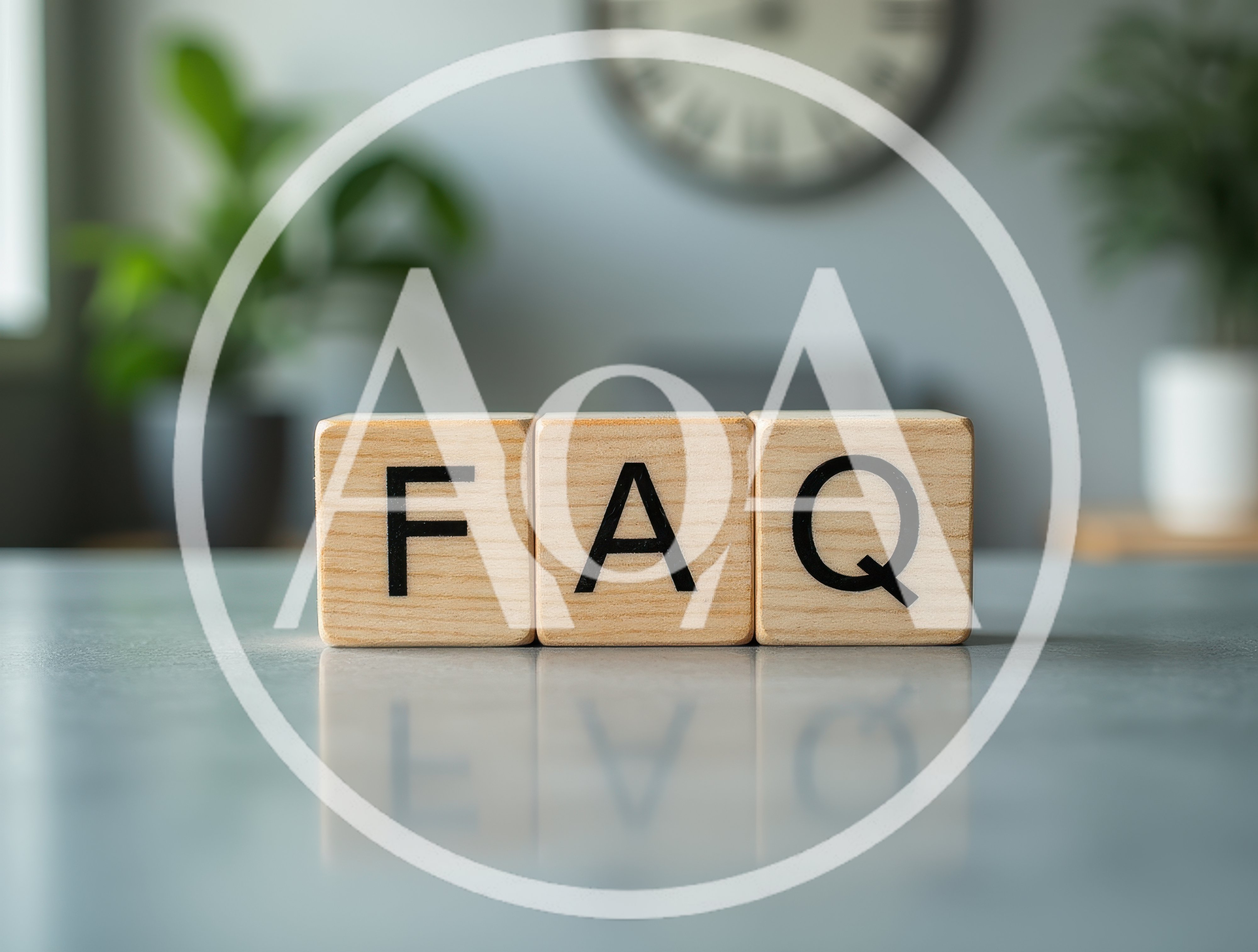 Wooden Blocks Spelling FAQ On A Reflective Surface