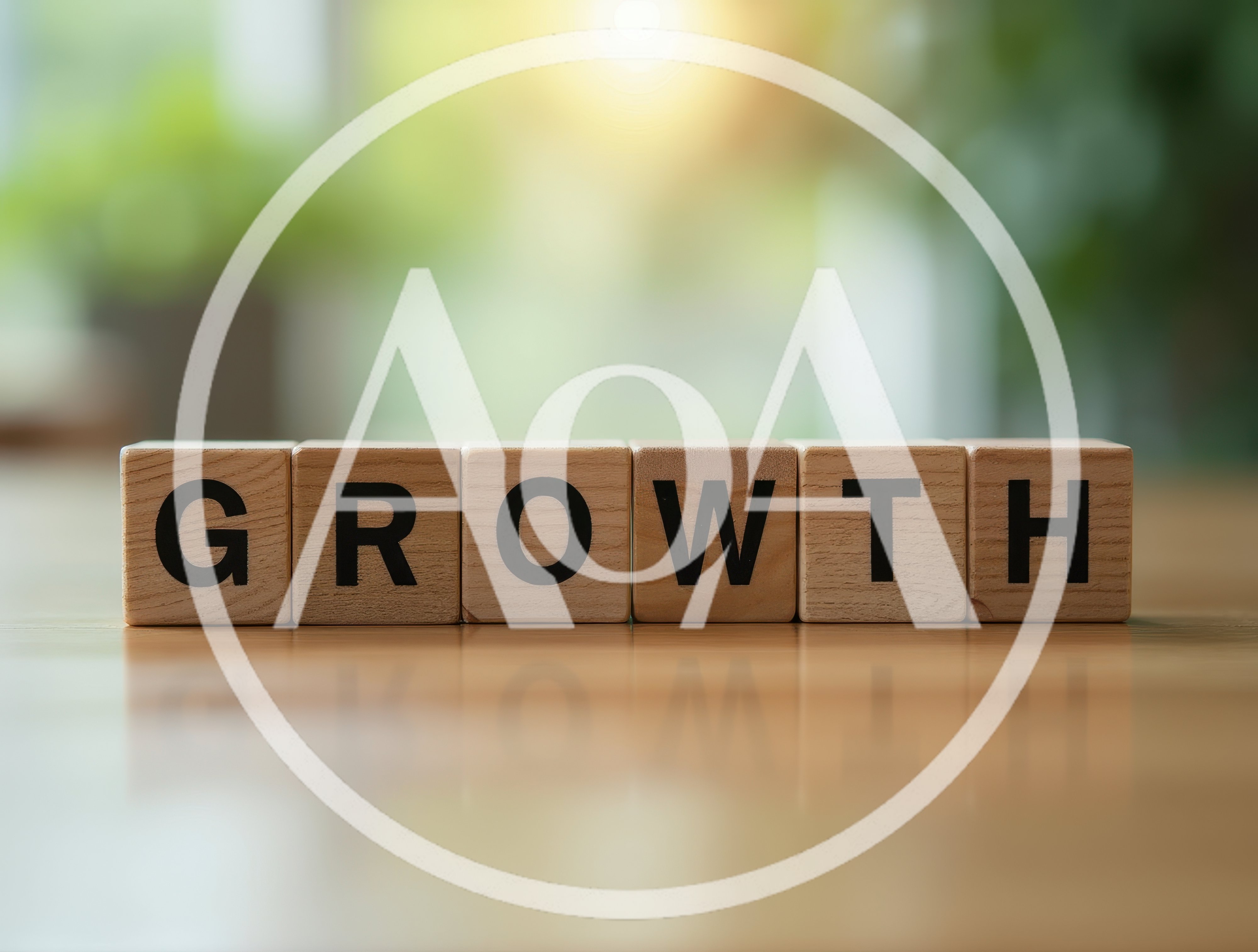 Wooden Blocks Spelling Growth on a Wooden Table