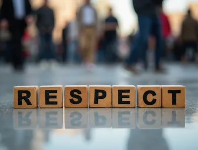 Wooden Blocks Spelling Respect On A Reflective Surface