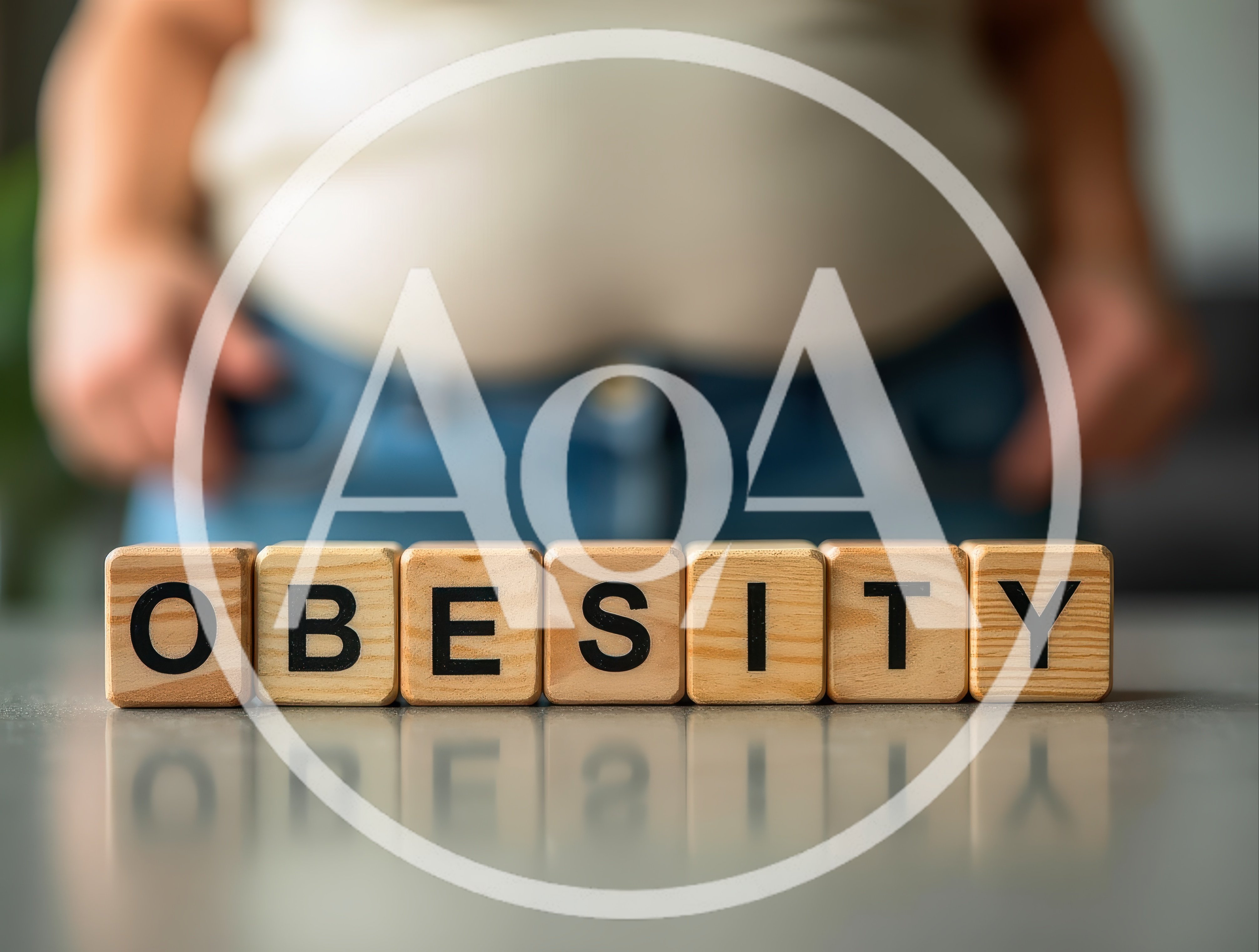 Wooden Blocks Spelling Obesity In Front Of Overweight Person
