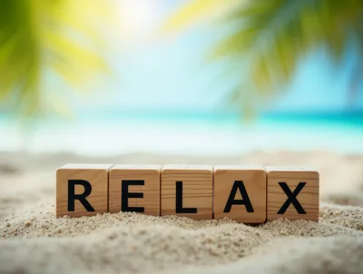 Wooden Blocks Spelling Relax on Tropical Beach Sand