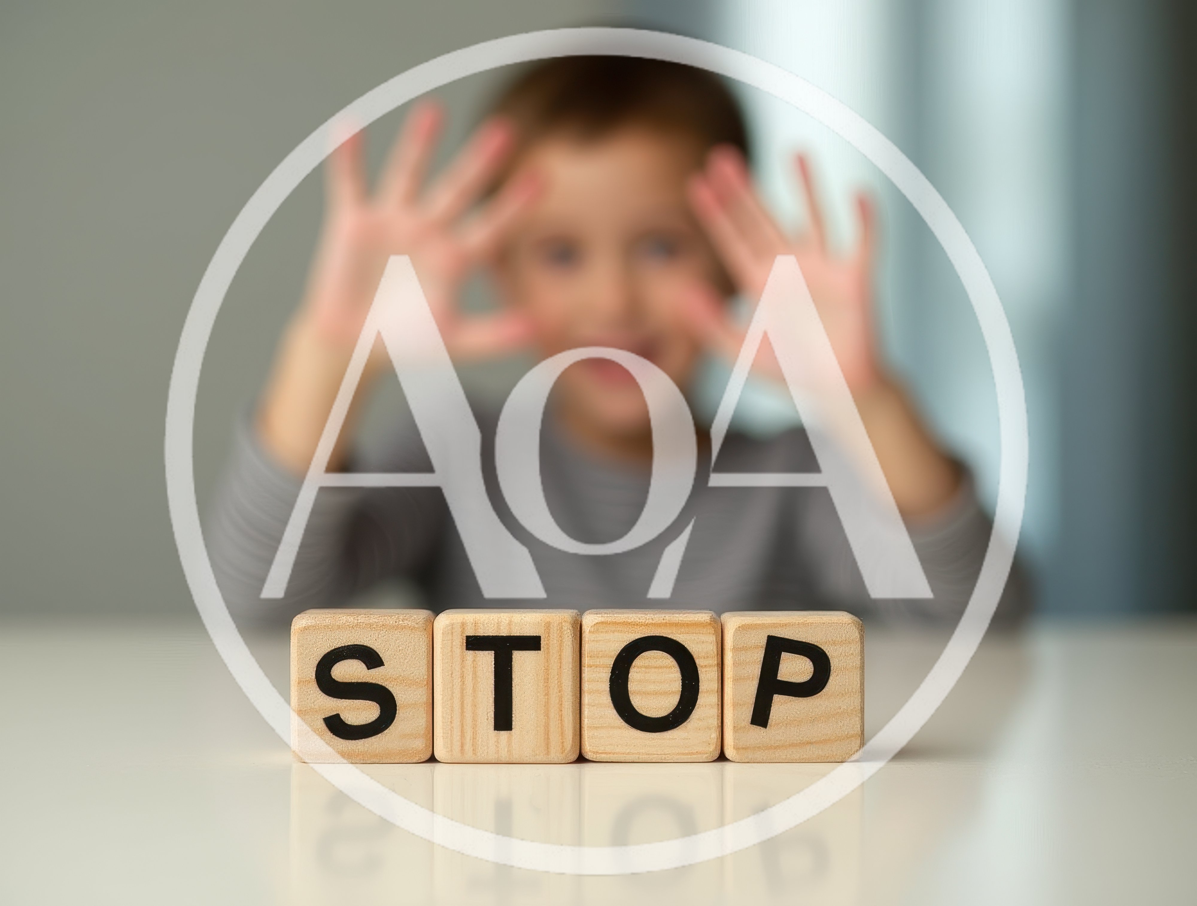 Child Holding Hands Up Behind Wooden Stop Blocks
