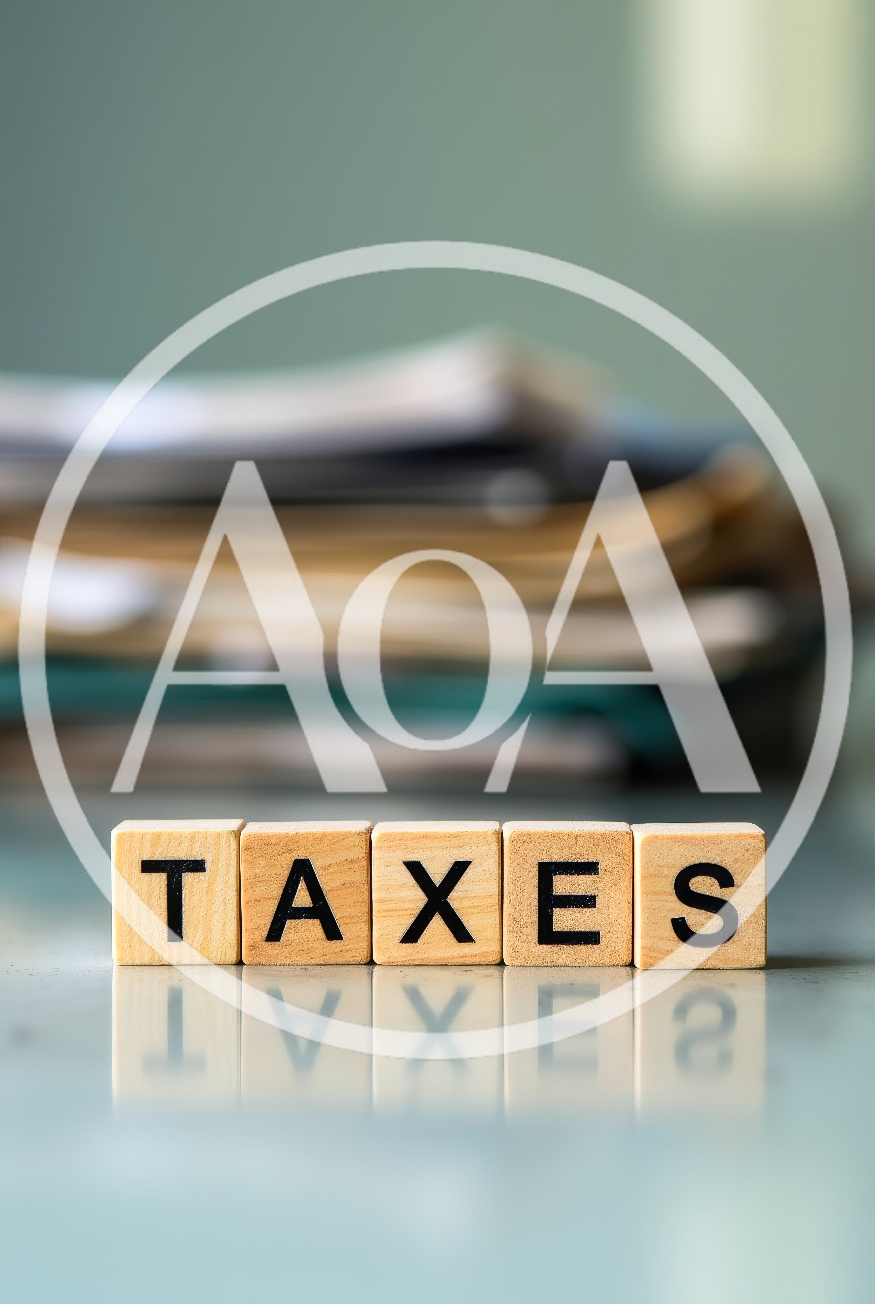 Wooden Blocks Spelling Taxes With Blurred Paperwork Background