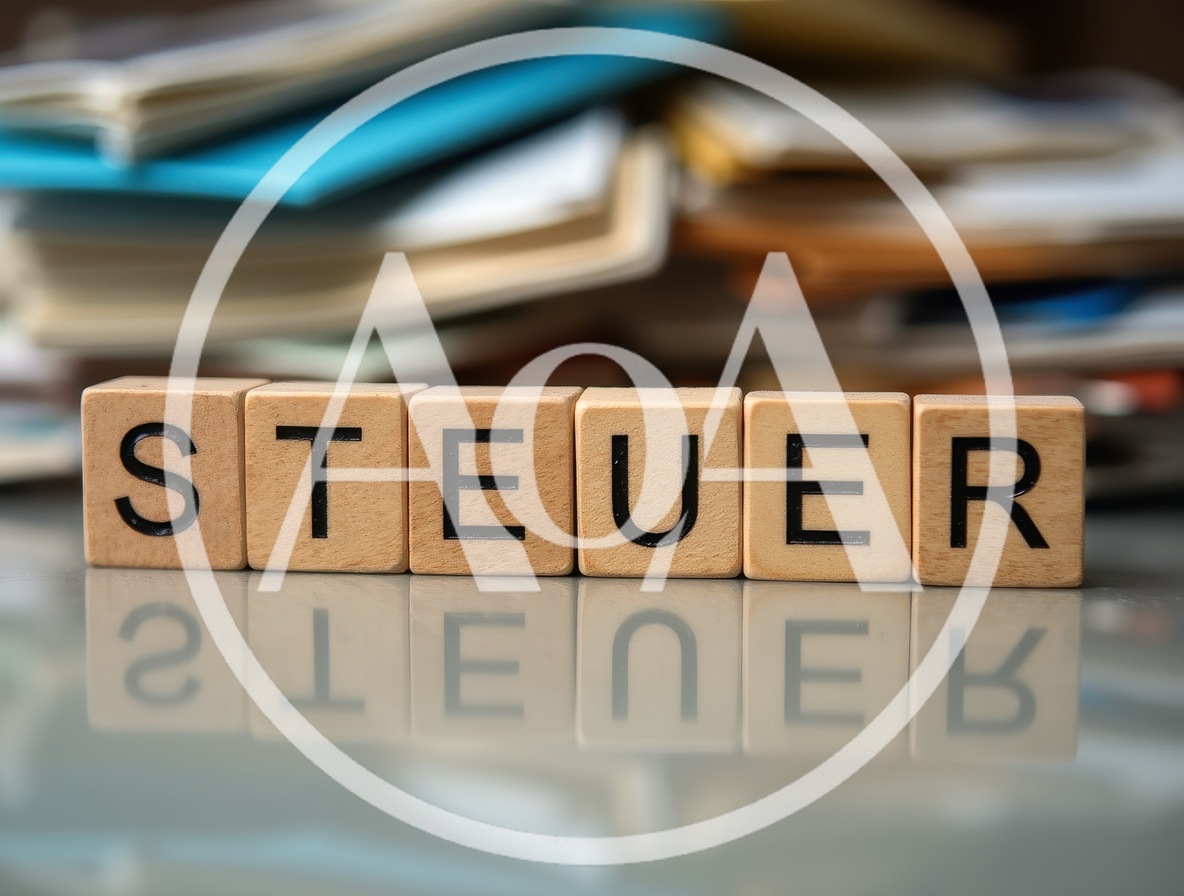 Wooden Letter Tiles Spelling Steuer On Reflective Surface