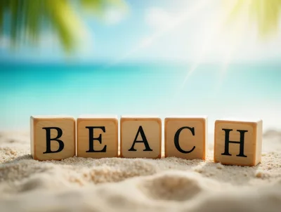Wooden Blocks Spelling Beach On Tropical Sand