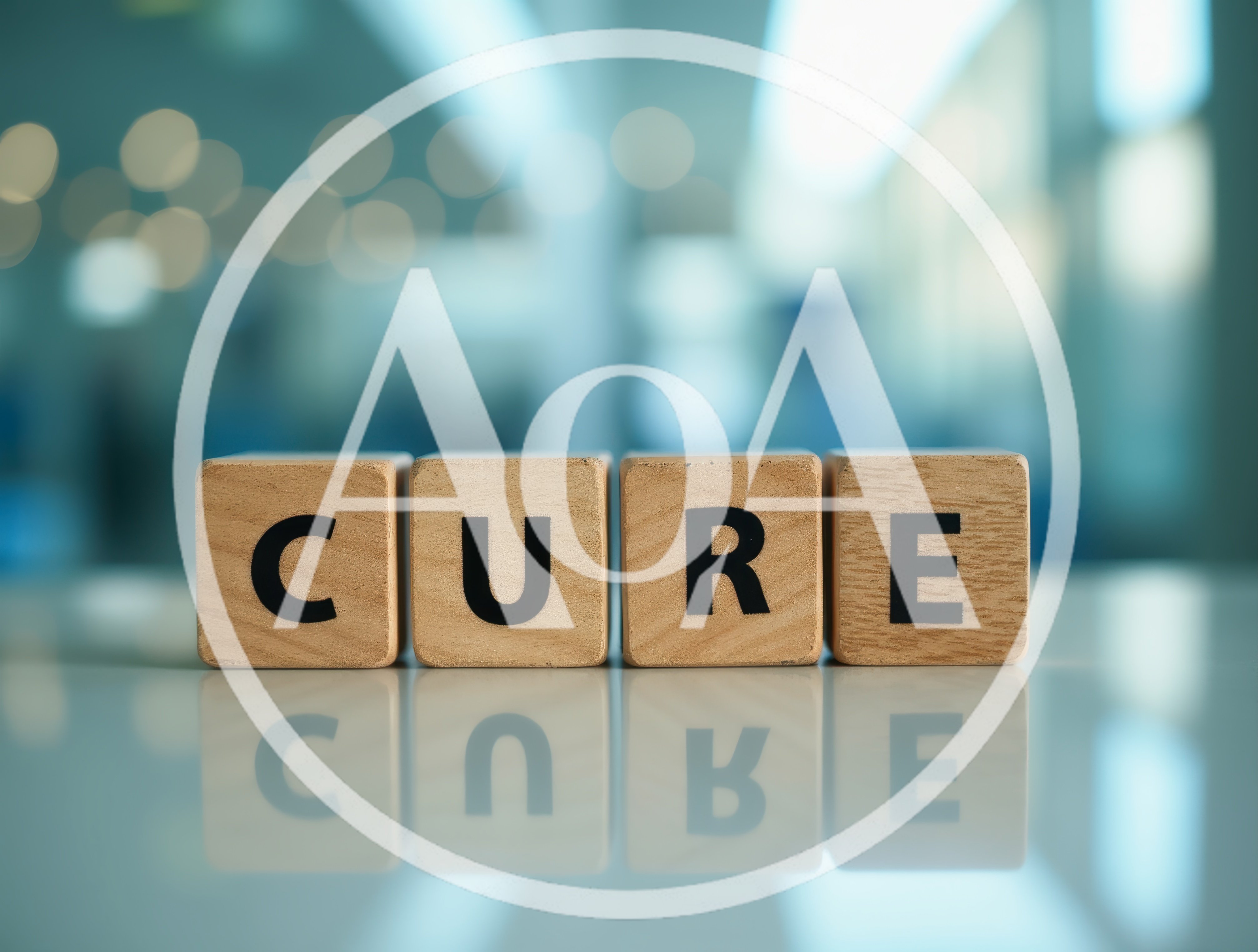 Wooden Blocks Spelling The Word Cure On Reflective Surface