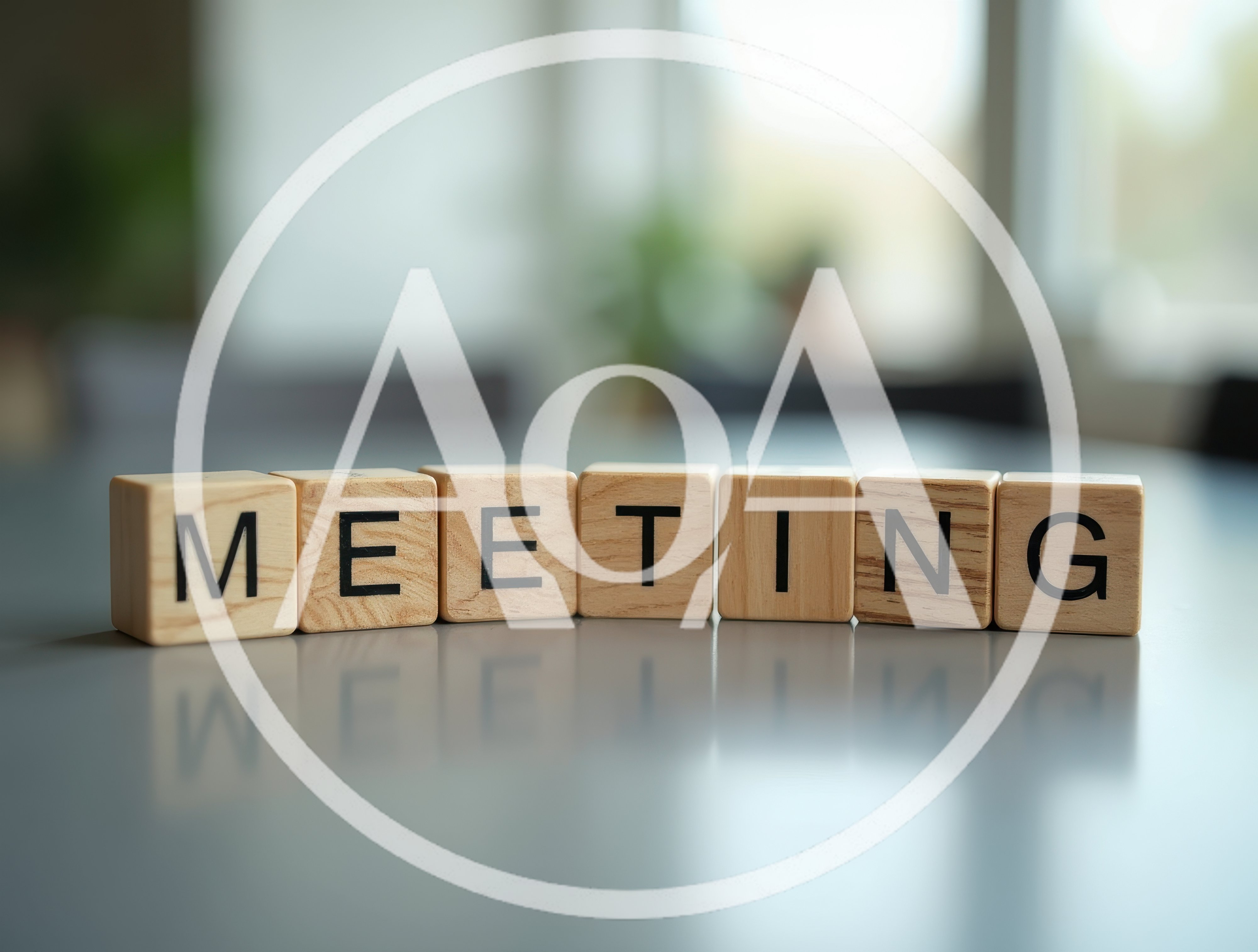 Wooden Blocks Spelling Meeting On A Reflective Table