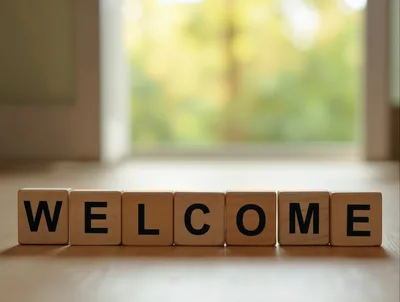 Wooden Blocks Spelling Welcome On A Table