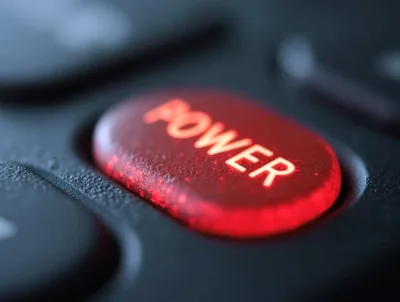 Macro Close Up Of A Glowing Red Power Button