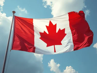 Canadian Flag Waving Against A Blue Sky