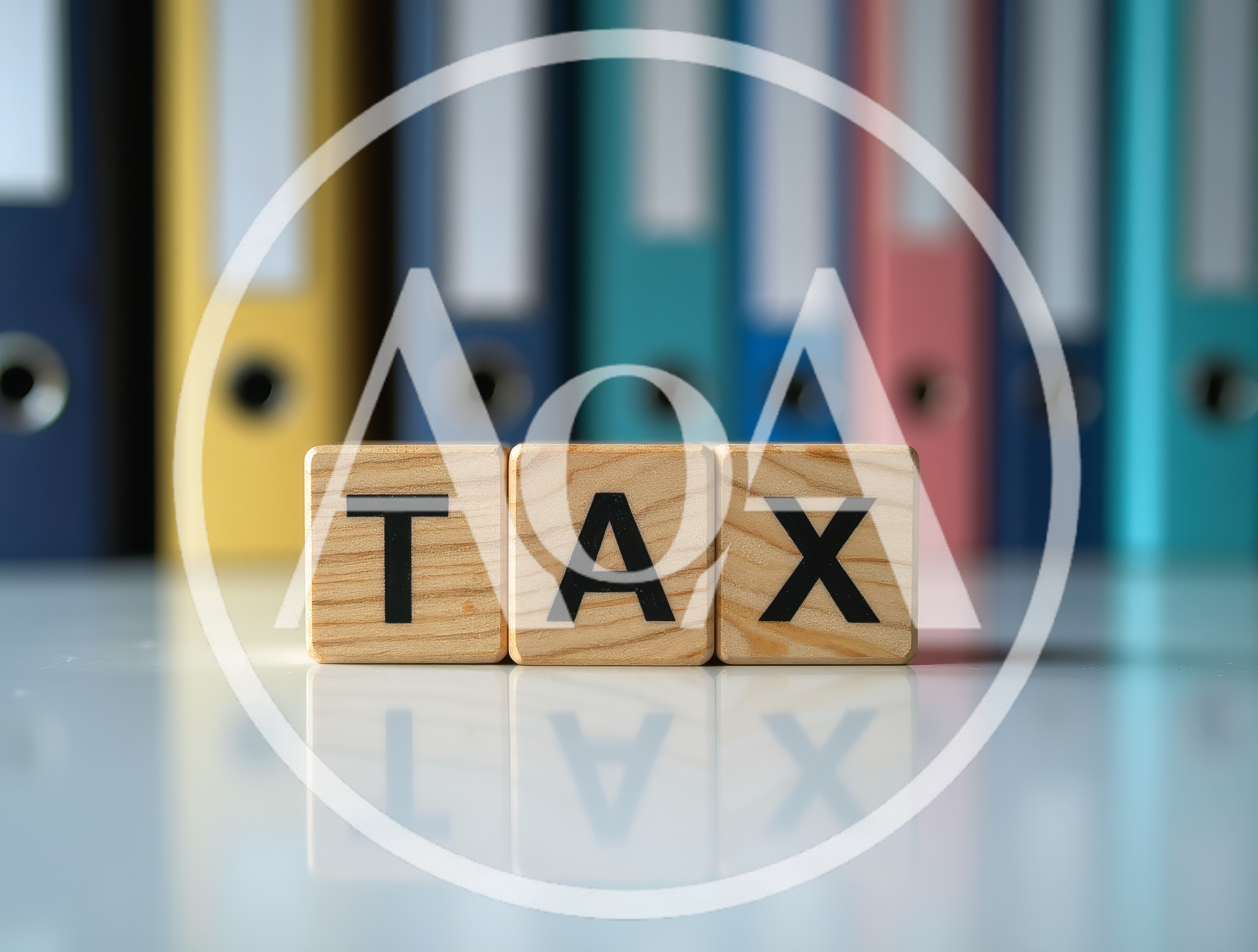 Wooden Blocks Spelling Tax With Office Binders Background
