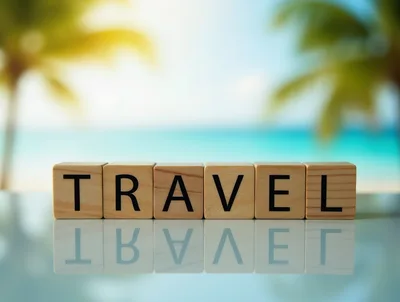 Wooden Blocks Spelling Travel on a Reflective Surface