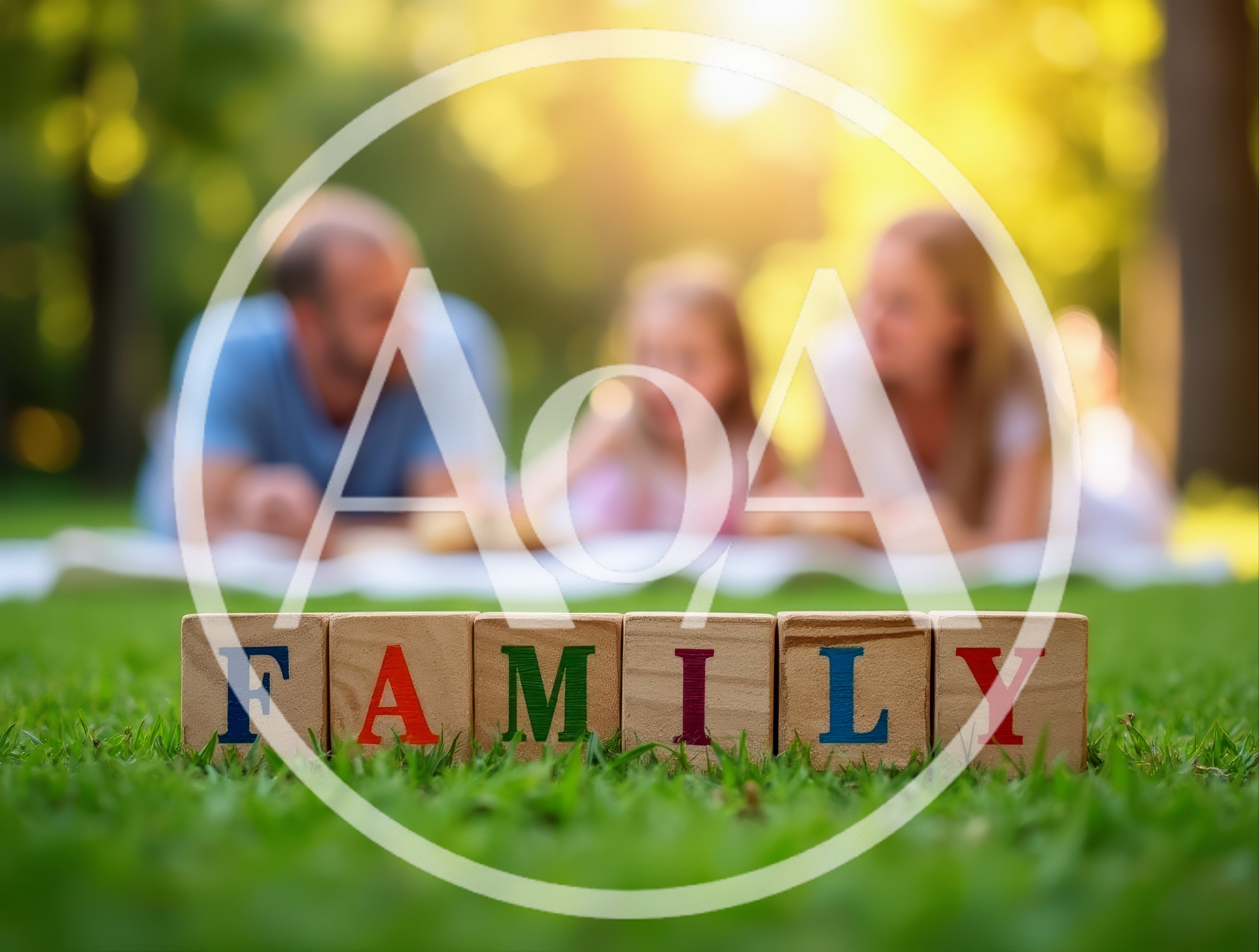 Wooden Blocks Spelling Family On Green Grass