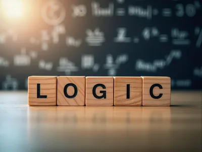 Wooden Blocks Spelling Logic On A Desk