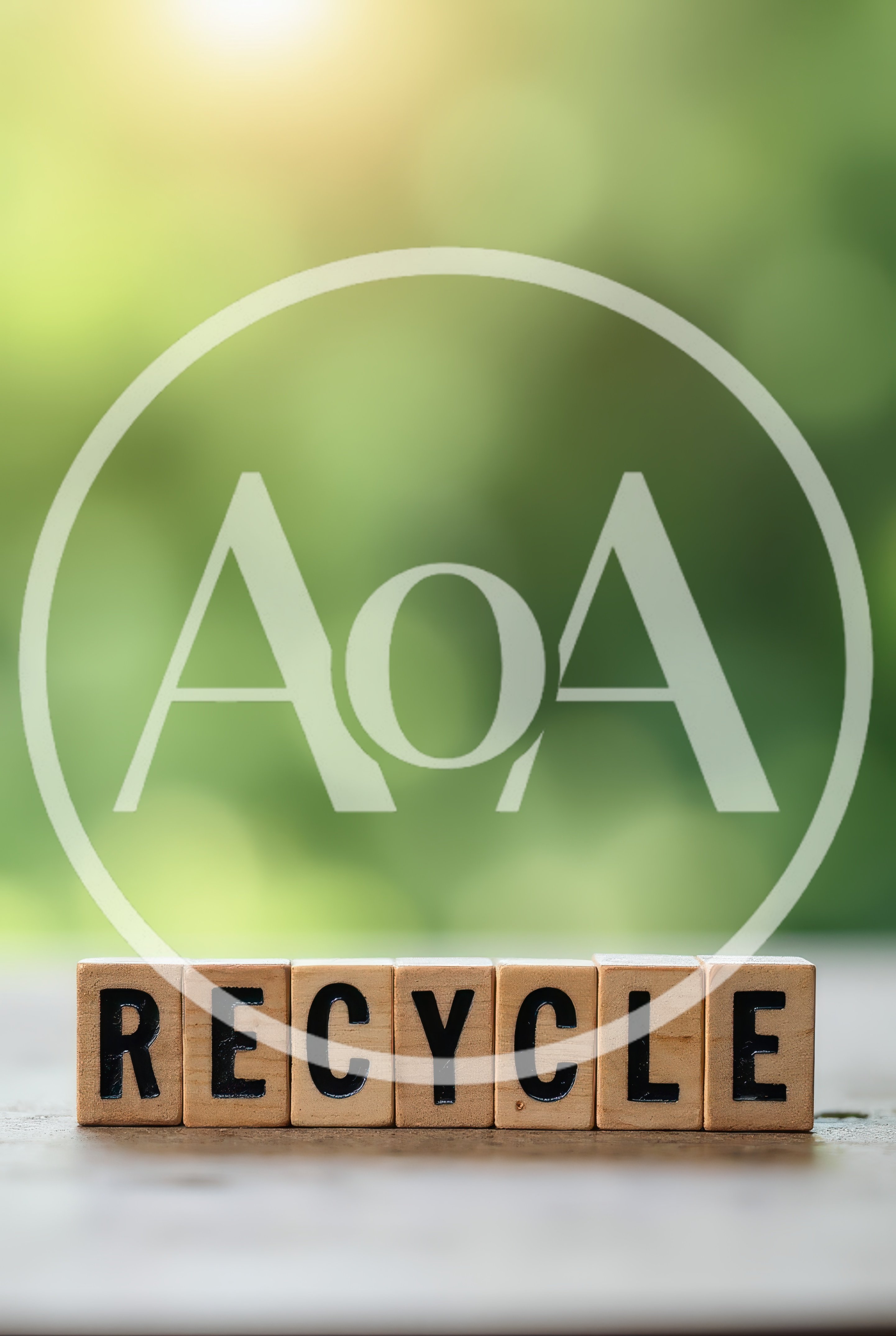 Wooden Blocks Spelling Recycle On A Blurred Green Background