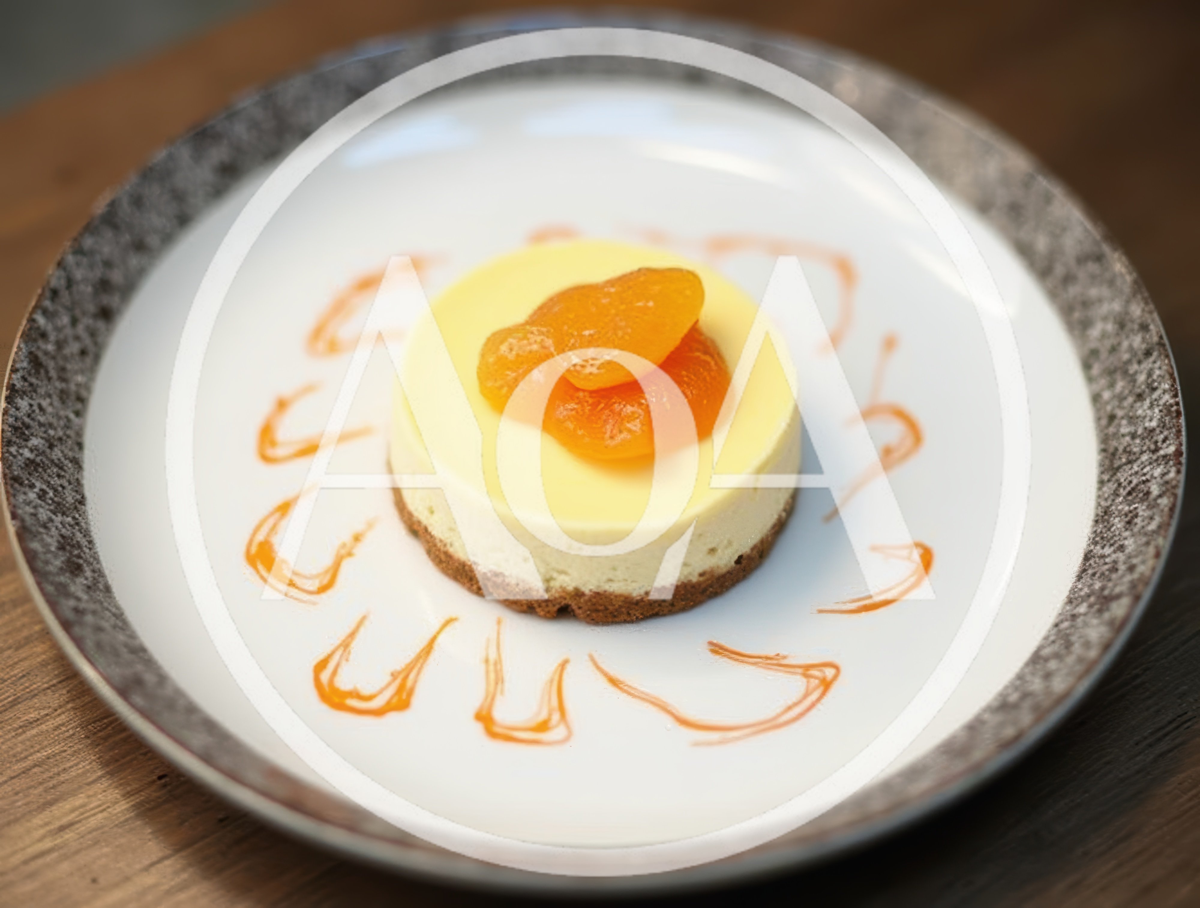 Small Round Cheesecake With Apricot Topping On Plate