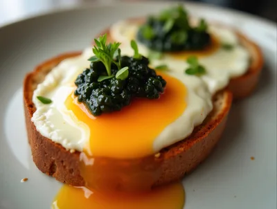 Fried Eggs With Caviar On Toasted Bread