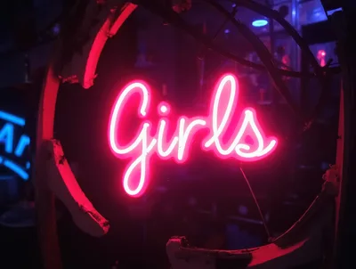 Bright Pink Neon Girls Sign In Dark Setting