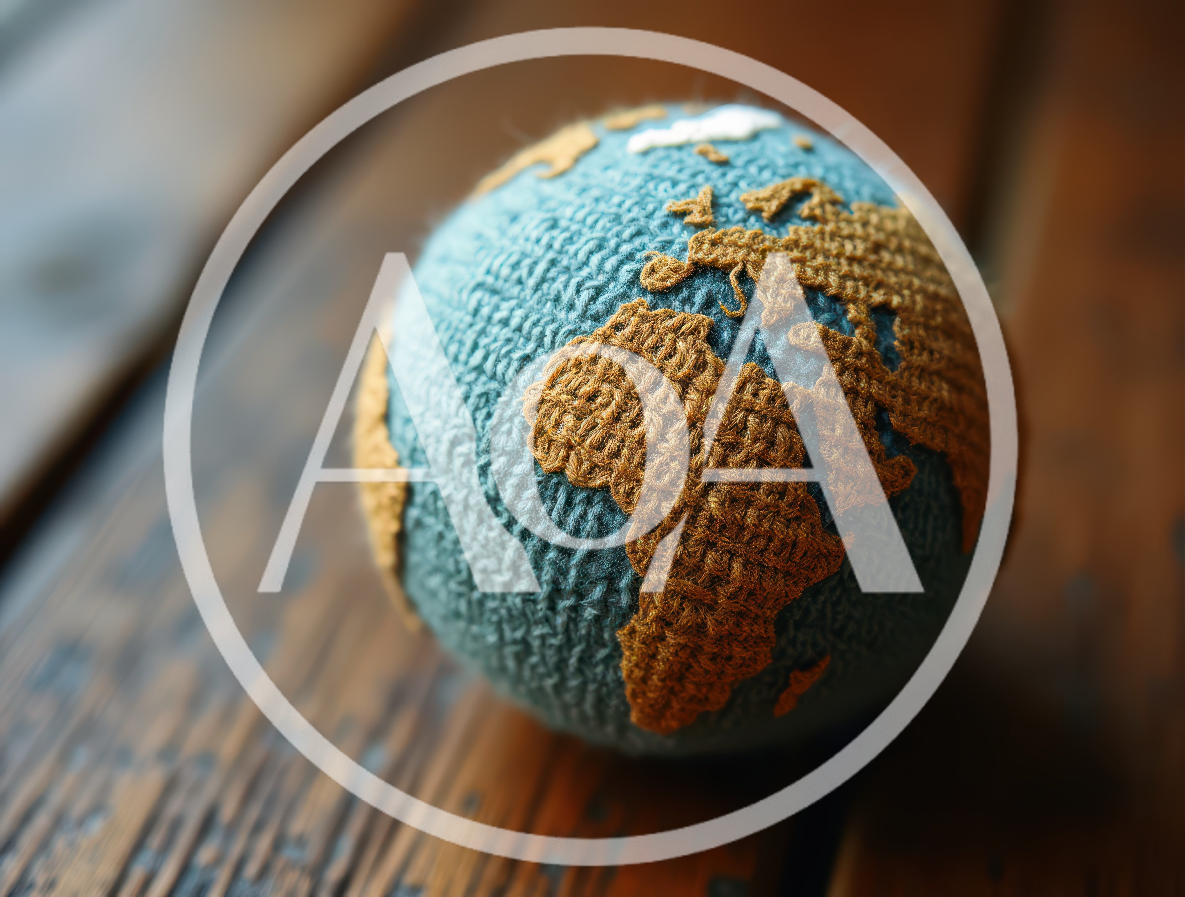 Crocheted Globe Resting On A Wooden Surface