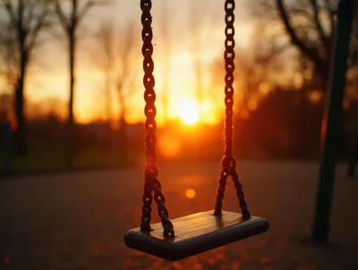 Empty Swing Set at Sunset in a Park