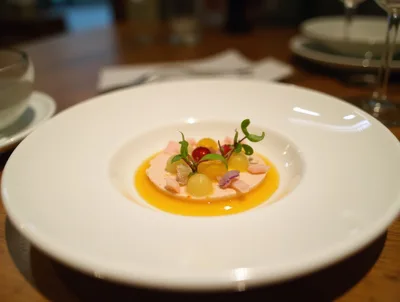 Gourmet Plated Dessert With Fruit And Sauce
