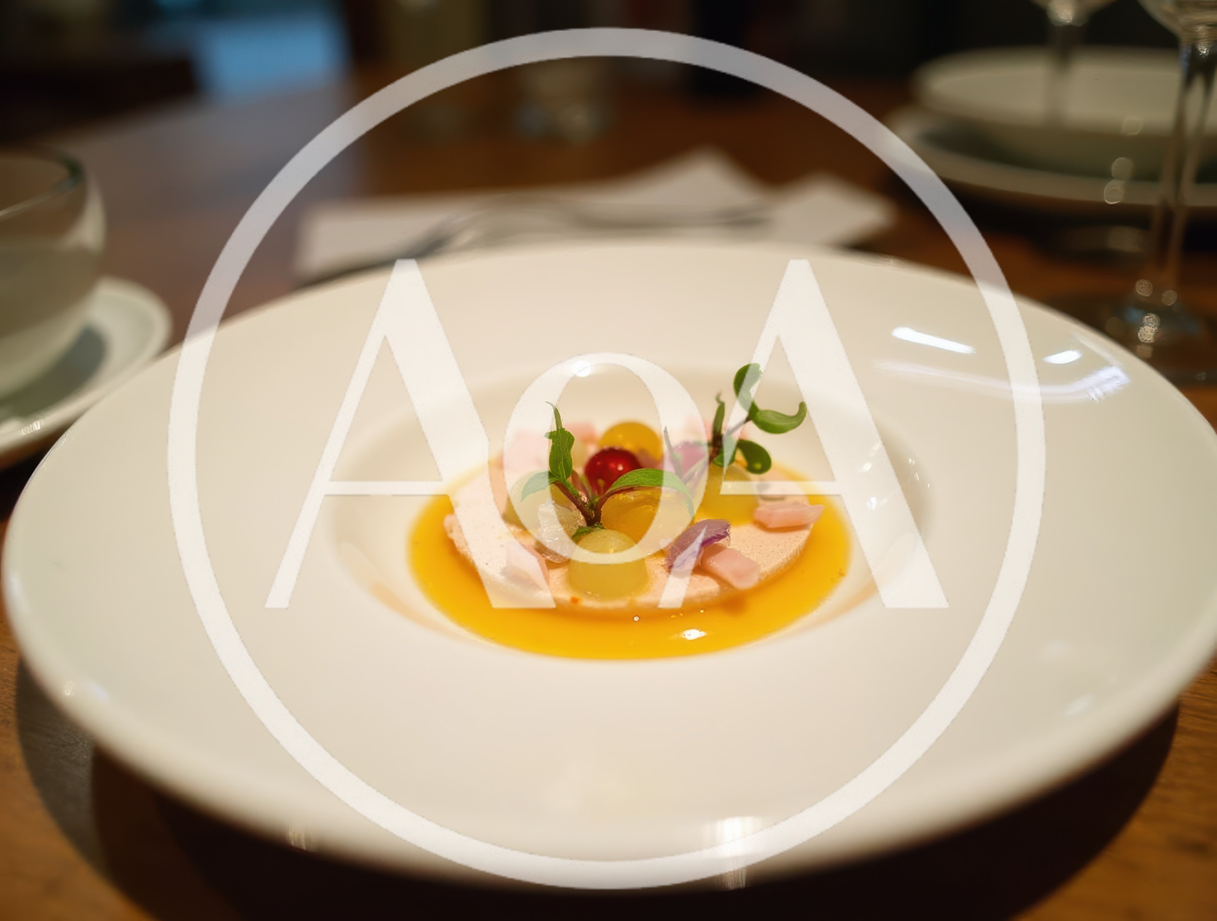 Gourmet Plated Dessert With Fruit And Sauce