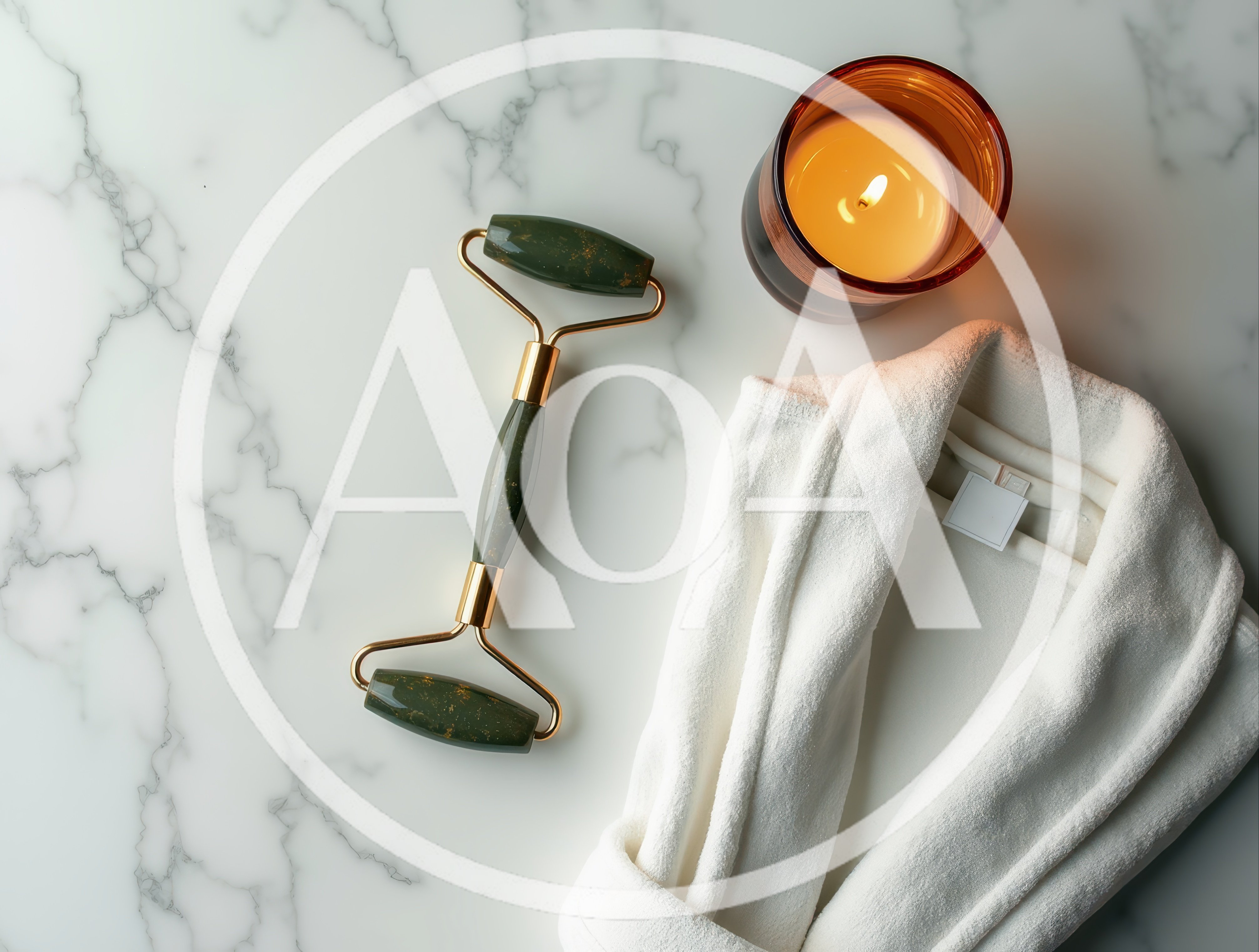 Jade Facial Roller and White Bathrobe on Marble