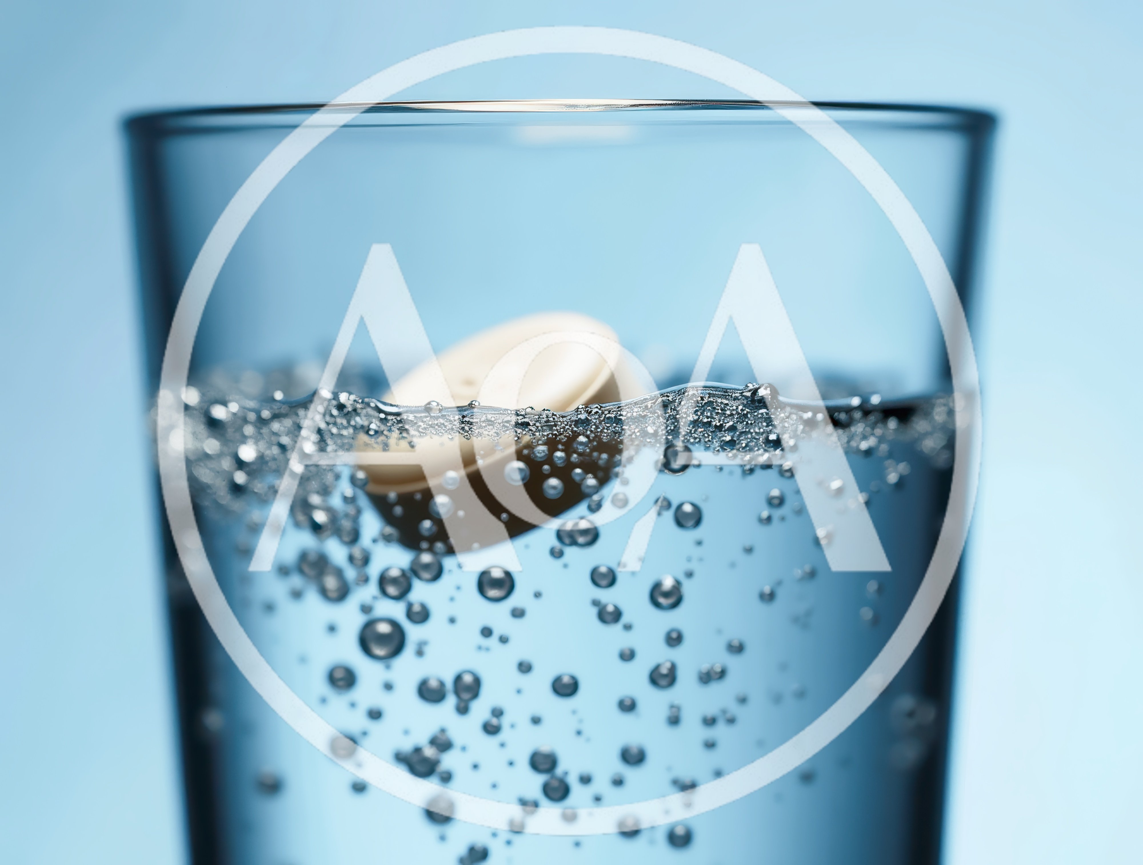 Effervescent Tablet Dissolving In A Glass Of Water