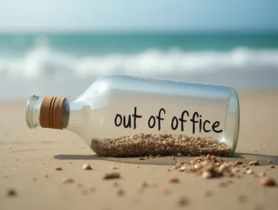Glass Bottle With Out Of Office Message On Beach