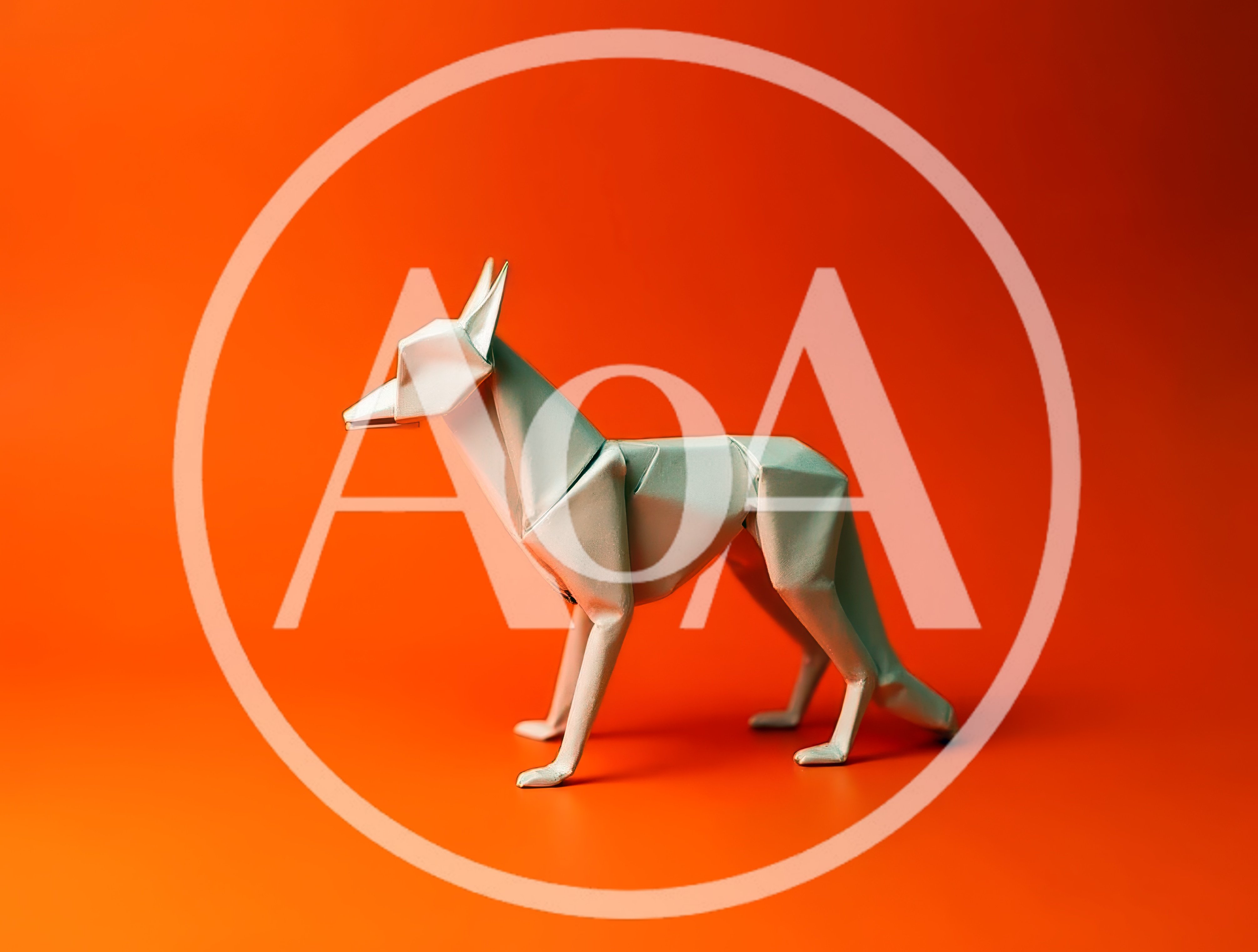Origami Paper Wolf Figurine On Orange Background