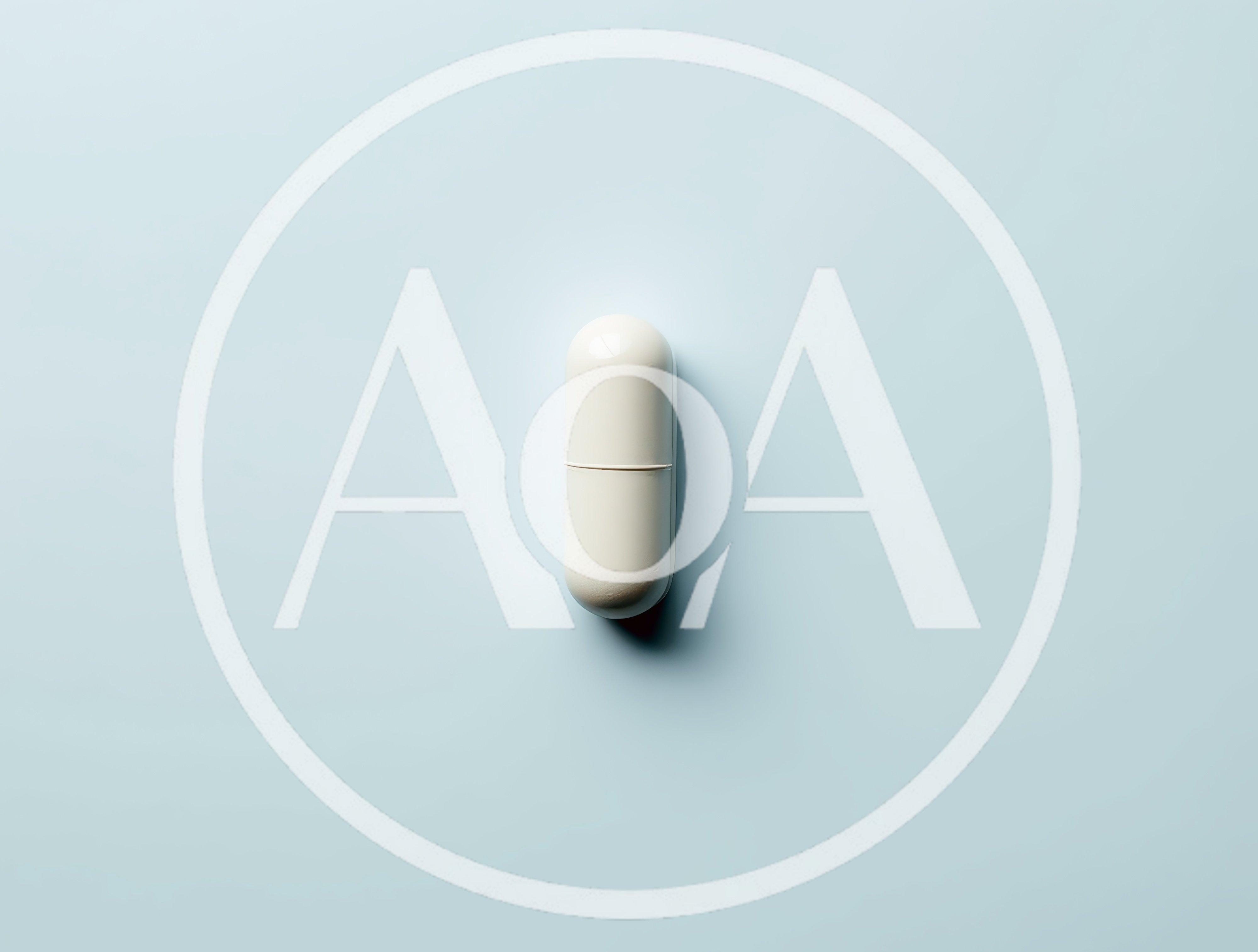Single White Medical Capsule On Light Blue Background