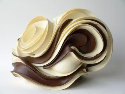Abstract Chocolate Sculpture With Swirling White And Dark Layers